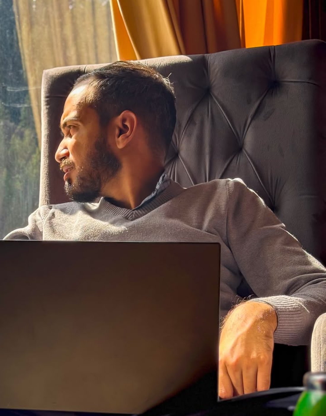 Waqar Ahmed, founder of Capital Captains, working at his laptop